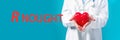 R Nought theme with a doctor holding a heart Royalty Free Stock Photo