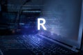 R programming language inscription against laptop and code background. Learn r, computer courses, training Royalty Free Stock Photo