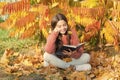 R is for reading. Cute small child learn reading on sunny autumn day. Adorable little girl reading book on natural Royalty Free Stock Photo