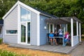 Raa, Sweden - 17.06.2018: Group of people in grey camping cabins in small swedish town Raa