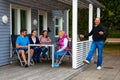 Raa, Sweden - 17.06.2018: Group of people in grey camping cabins in small swedish town Raa