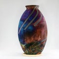 RAAQUU raku fired pottery globe vase Royalty Free Stock Photo