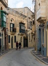 Rabat, Narrow street and facades of residential houses with wooden doors and bow windows