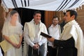 Rabbi blessing Jewish bride and a bridegroom in Jewish wedding c Royalty Free Stock Photo
