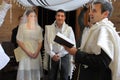 Rabbi blessing Jewish bride and a bridegroom in Jewish wedding ceremony Royalty Free Stock Photo