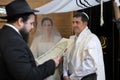 Rabbi reading the Jewish Marriage Contract to Jewish bride and a bridegroom in Jewish wedding ceremony Royalty Free Stock Photo