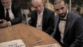 Rabbi reading Ketubah to the groom in Jewish wedding