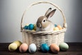 Rabbit amongst coloured eggs in basket