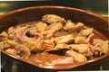 Rabbit and chicken meat frying in a clay pot Royalty Free Stock Photo