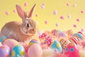 Rabbit enjoying Easter event atop colorful eggs, filled with sweetness and fun