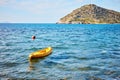 Rabbit island and a yellow canoe on the sea in Bodrum Gumusluk T