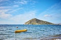 Rabbit island and a yellow canoe on the sea in Bodrum Gumusluk T