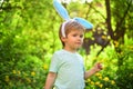Rabbit kid with bunny ears. Hare. Egg hunt on spring holiday. love easter. Family holiday. Little boy child in green