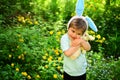 Rabbit kid with bunny ears. Hare toy. Egg hunt on spring holiday. love easter. Family holiday. Little boy child in green