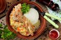 Rabbit leg with cream sauce with carrot onion and rice