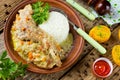 Rabbit leg with cream sauce with carrot onion and rice