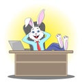 Rabbit manager in a man`s suit sits at the office table, having Royalty Free Stock Photo