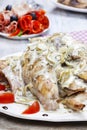 Rabbit in onion sauce on party table Royalty Free Stock Photo