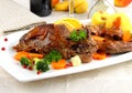 Rabbit pan with vegetables and potato dumplings Royalty Free Stock Photo