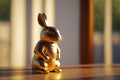 Rabbit samurai golden mini-figure. Japanese styled figure of meditating hare in kimono. Generated AI.