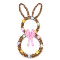 Rabbit-shaped easter wreath with branches cherry flowers and eggs