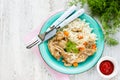 Rabbit stew with carrot and mushroom with a side dish of basmati rice