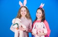 Rabbit style. Children in rabbit bunny ears. Spring holiday party. Egg hunt. Family and sisterhood. Little girls with Royalty Free Stock Photo