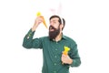 Rabbit style. happy easter holiday. funny man in rabbit ears. easter man hold carrot Royalty Free Stock Photo