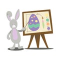 Rabbit teacher shows how to paint eggs for Easter