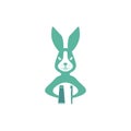 Rabbit with a toothbrush and a tube of toothpaste. Logo.Illustration. Royalty Free Stock Photo