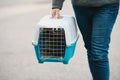 Rabbit in a transport box, pet locked in a cage, taking care of domestic animal, vacation or appointment at a vet doctor