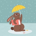 Rabbit walking under umbrella with book. Autumn rainy postcard. Bunny or hare - childish mascot 2023 symbol year Royalty Free Stock Photo