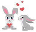 Two cute rabbits. One holding a heart.