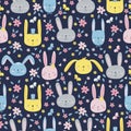 Rabbits seamless pattern. Multi-colored assorted hand-drawn rabbits in a simple cartoon style dark blue background.