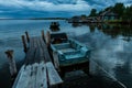 RABOCHEOSTROVSK, RUSSIA - AUGUST 13, 2018: Fishing boats at the pier during sunset