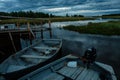 RABOCHEOSTROVSK, RUSSIA - AUGUST 13, 2018: Fishing boats at the pier during sunset