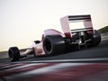 Race car back view speeding down a track with motion blur