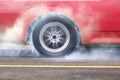 Race car burns rubber off its tires Royalty Free Stock Photo