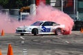 Race car power drift and burnout with purple smoke