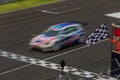 Race car racing on speed track Royalty Free Stock Photo