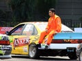 Race Driver Sit on The Trunk Hood