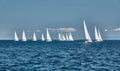 The race of sailboats, a sail regatta, reflection of sails on water, Intense competition, number of boat is on aft boats