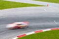 Race track with a blurred sport car