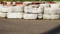 Race track safety barrier. asphalt racing track with red and white tires. colorful tires stack. karting racetrack Royalty Free Stock Photo