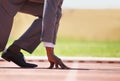 Race track, start and man in a suit for sport, running and fitness, cardio and speed practice. Starting line, ready and Royalty Free Stock Photo