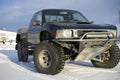 Race truck parked in snow