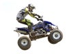 Racer while jumping a quad bike. Royalty Free Stock Photo