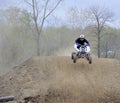 Racer Rides an ATV Down a Dirt Hill