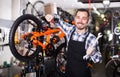 Racer is working on master bicycle assembly Royalty Free Stock Photo