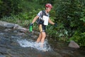 Racers makes way across a river in the morning